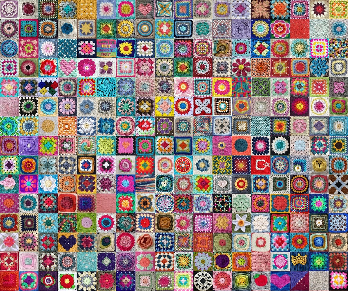Dozens of crocheted granny squares in many colors, for the granny square calculator