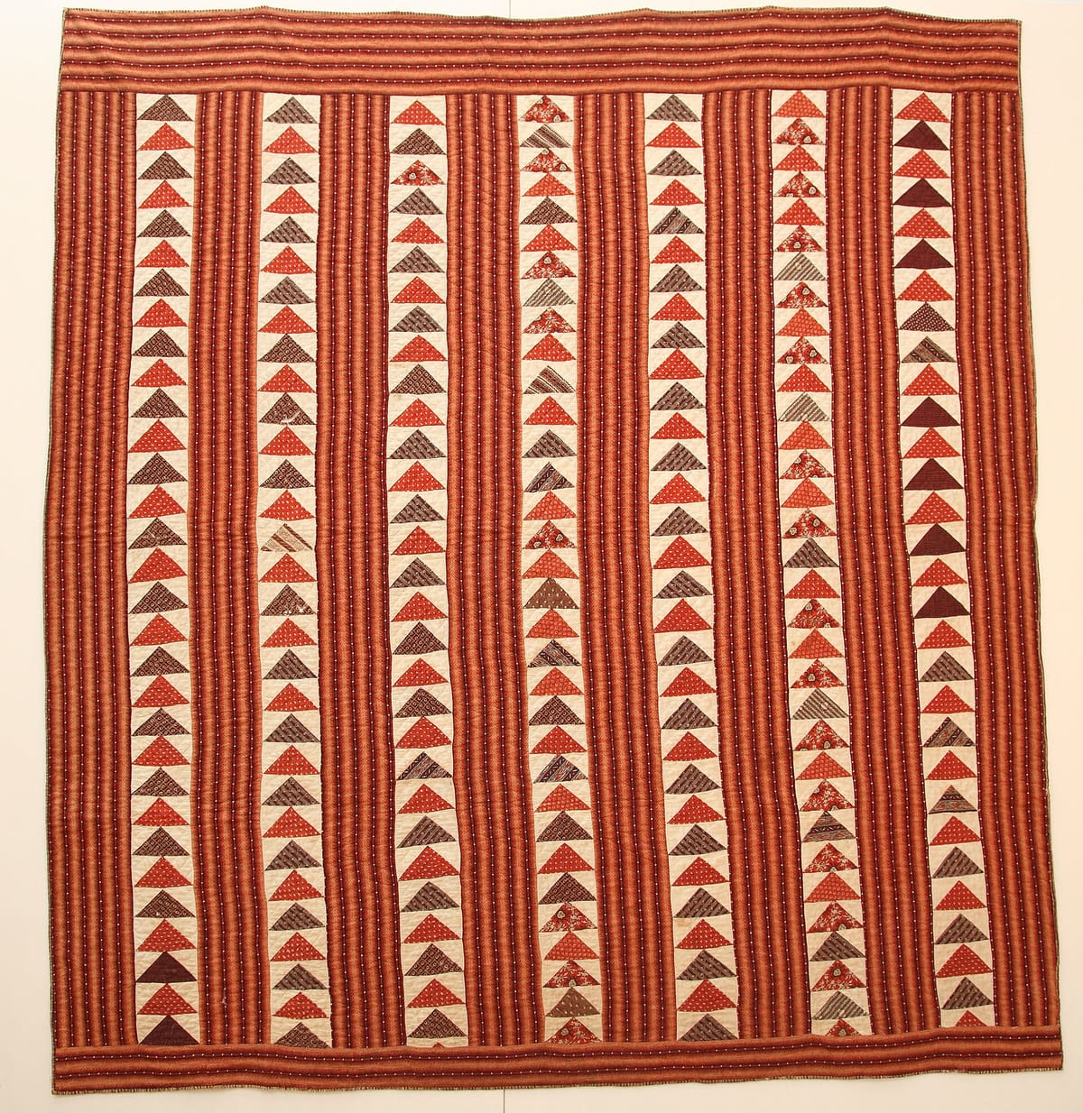 Antique wild goose chase quilt with rows of pieced triangles, a use for half-square triangles and flying geese